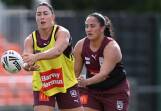 Queensland forward Romy Teitzel (l) emerged from hardship to become a key figure for the Maroons. (Darren England/AAP PHOTOS)