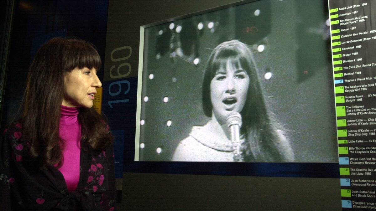 The Seekers lead singer Judith Durham watching old footage of the band at the launch of 'Sights and Sounds of a Nation'. File picture