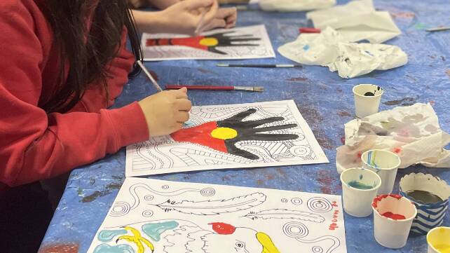 Carefully and creatively painting Indigenous designs during NAIDOC event at Jigamy in 2023. Picture by Jimmy Parker