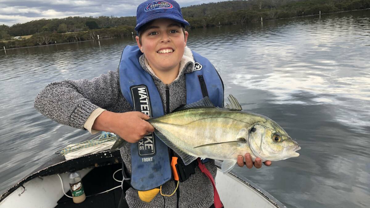 Junior angler Kade Jenkins of Tura Beach shows off a lovely trevally, one of the fish listed in this competition.