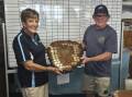 President of last year's Grudge Match winner Pambula Fishing Club Joe Klimas passes on the trophies to the 2024 winner Eden Amateur Fishing club president Val Cartledge. Picture supplied