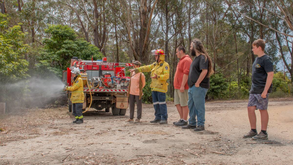 The RFS demonstrates some of the equipment to the project team. Picture by Jake Dempsey